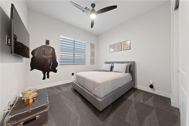 bedroom featuring ceiling fan and dark carpet