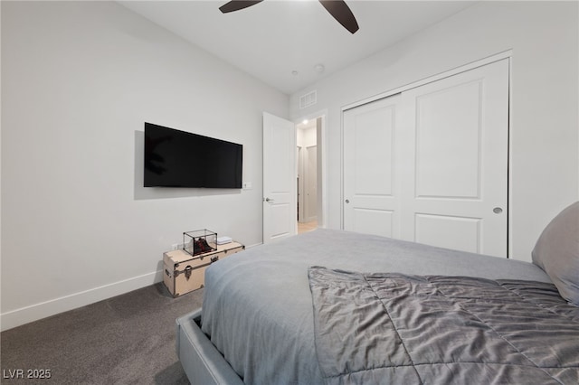 carpeted bedroom featuring a closet and ceiling fan