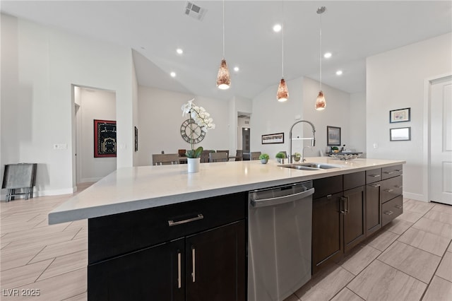 kitchen with lofted ceiling, sink, hanging light fixtures, a center island with sink, and stainless steel dishwasher