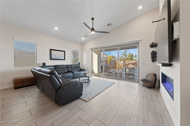 living room featuring lofted ceiling and ceiling fan