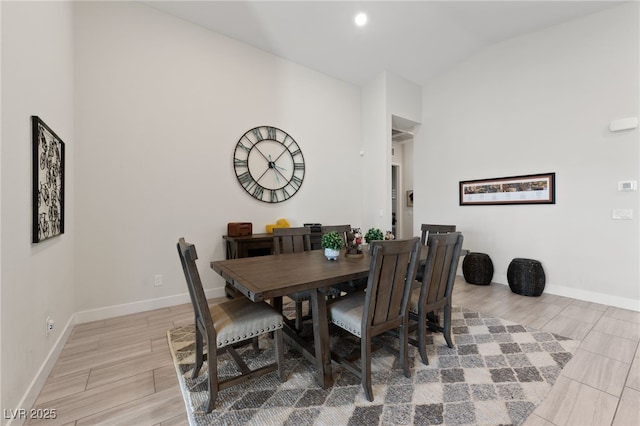 dining room with vaulted ceiling