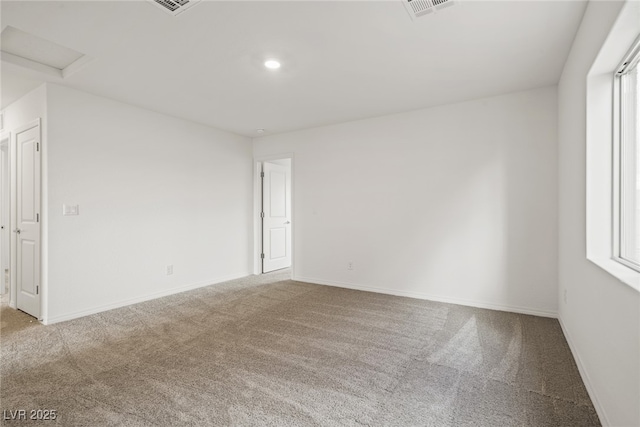 carpeted empty room with a wealth of natural light