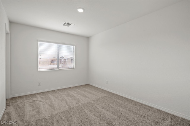 spare room featuring carpet floors