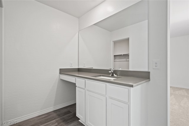 bathroom featuring vanity and hardwood / wood-style flooring