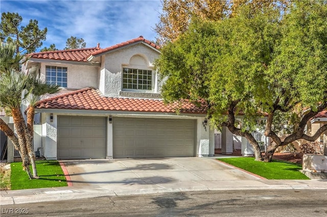 mediterranean / spanish-style home featuring a garage