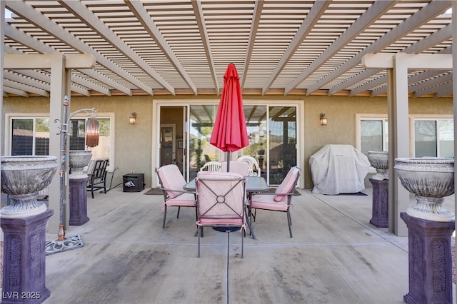 view of patio with outdoor dining space, area for grilling, and a pergola