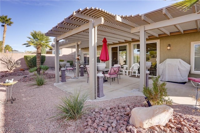 view of patio / terrace featuring fence, grilling area, and a pergola