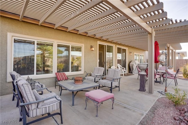 view of patio with an outdoor living space and a pergola