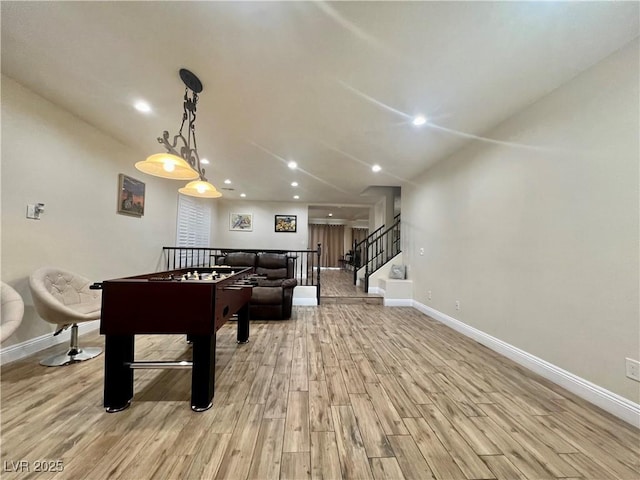 playroom with light hardwood / wood-style floors