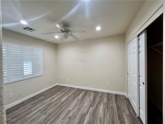 10618 Timber Stand St, Las Vegas, NV 89183 - unfurnished bedroom with a closet, visible vents, recessed lighting, dark wood finished floors, and baseboards