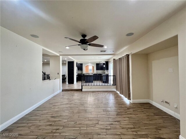 10618 Timber Stand St, Las Vegas, NV 89183 - unfurnished living room with baseboards, recessed lighting, ceiling fan, and wood finished floors