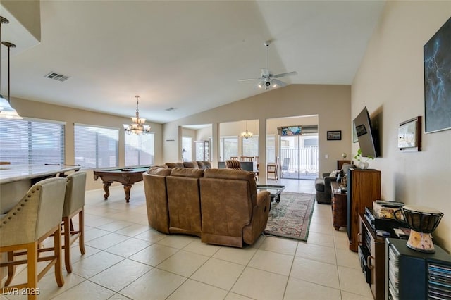 tiled living room with billiards, lofted ceiling, and ceiling fan with notable chandelier