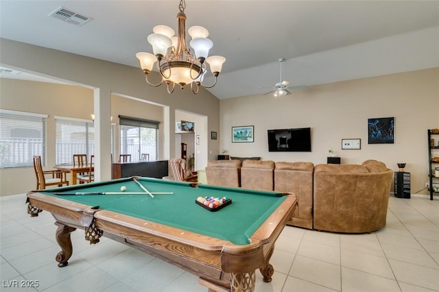 game room with vaulted ceiling, ceiling fan with notable chandelier, pool table, and light tile patterned floors