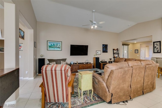 tiled living room with lofted ceiling and ceiling fan