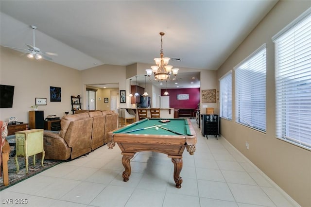 game room with pool table, bar area, vaulted ceiling, light tile patterned floors, and ceiling fan