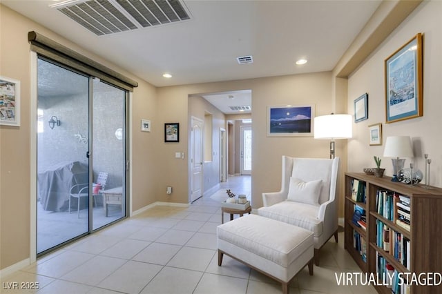 sitting room with light tile patterned flooring