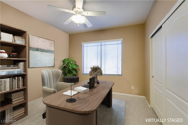 office area with light colored carpet and ceiling fan