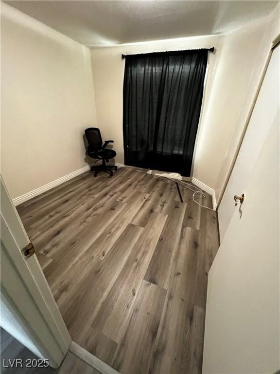 bedroom with wood-type flooring