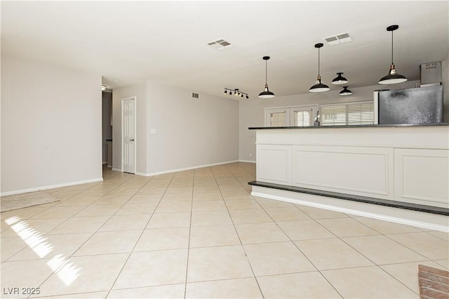 unfurnished living room with light tile patterned flooring