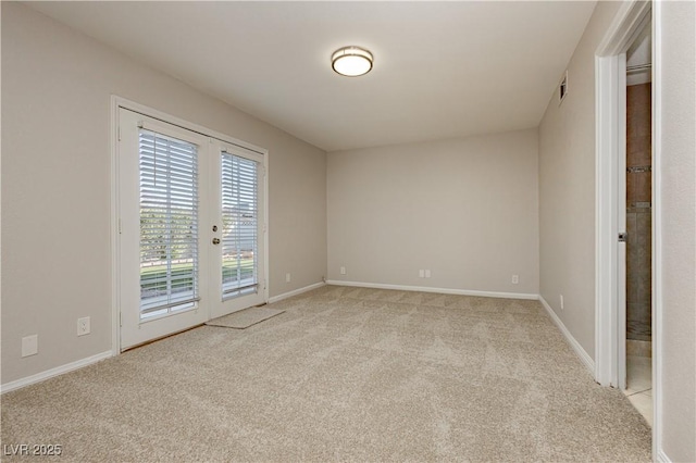 carpeted empty room with french doors