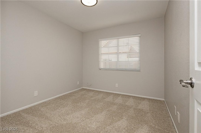 unfurnished room featuring light colored carpet