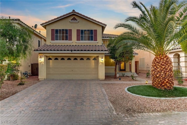 mediterranean / spanish-style house featuring a garage