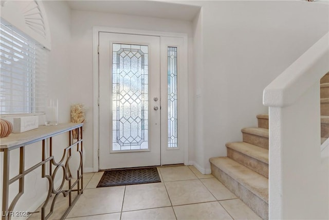 tiled foyer entrance with plenty of natural light