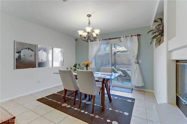 tiled dining area with a notable chandelier