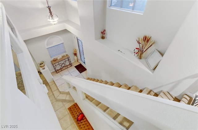 stairway with tile patterned floors