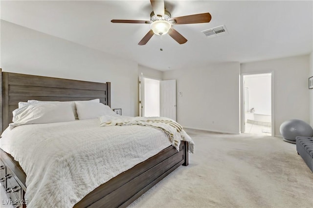 carpeted bedroom featuring connected bathroom and ceiling fan