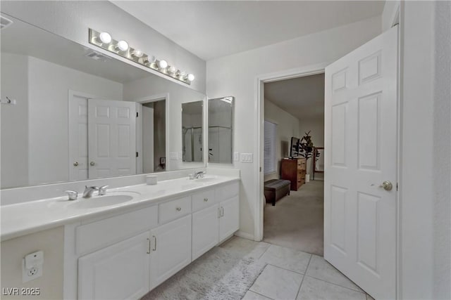 bathroom featuring tile patterned flooring and vanity