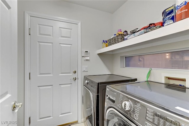 washroom featuring washer and clothes dryer