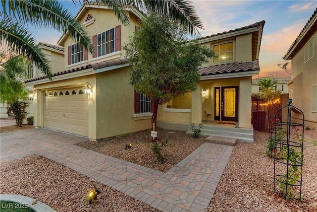 mediterranean / spanish-style home featuring a garage