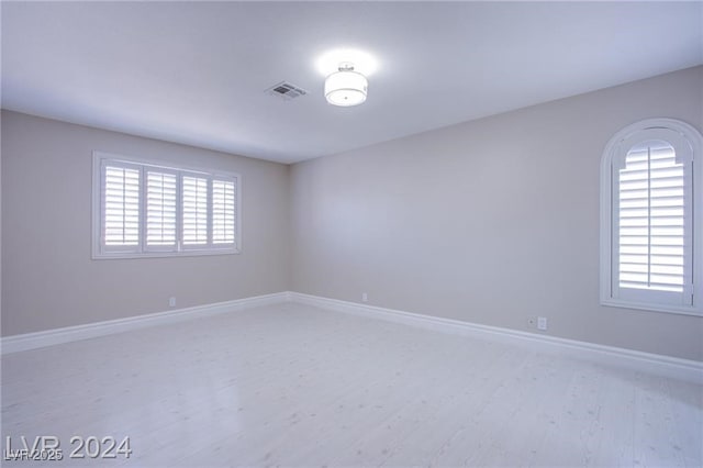 spare room featuring light hardwood / wood-style flooring