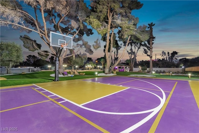 view of basketball court featuring a lawn