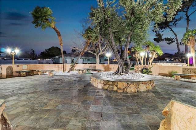 view of patio terrace at dusk