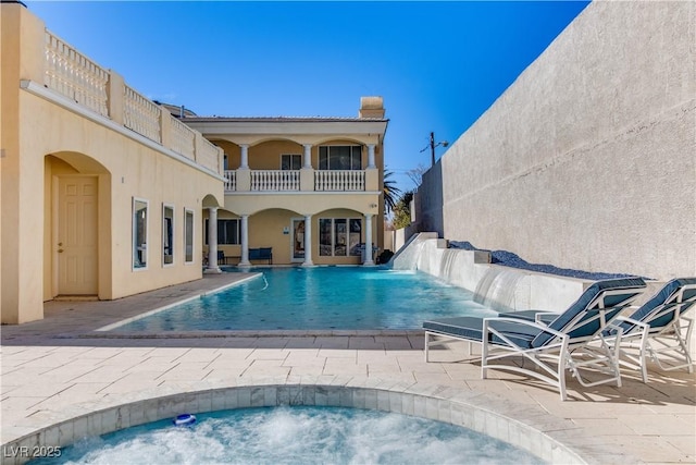 view of swimming pool with a patio