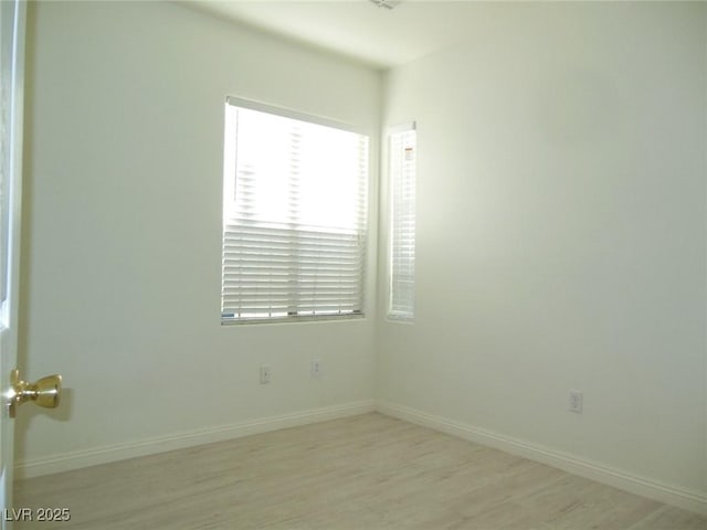 spare room featuring light wood-type flooring