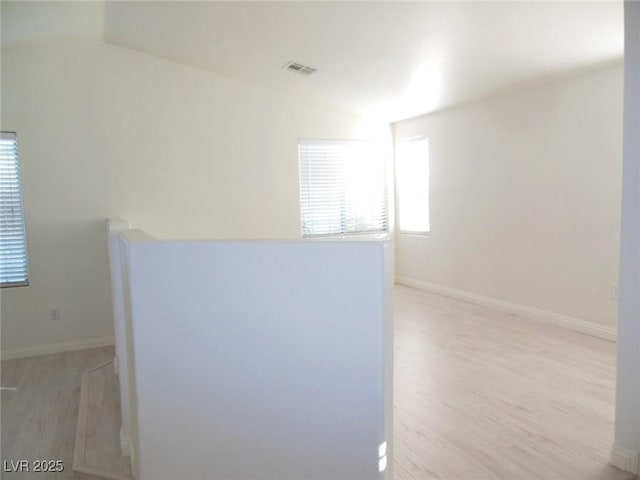 bathroom with hardwood / wood-style floors