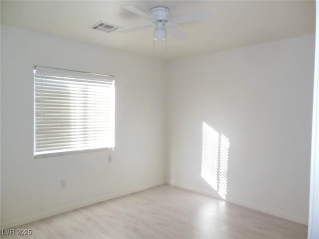 unfurnished room with ceiling fan and light hardwood / wood-style floors