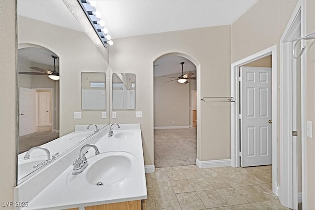 bathroom featuring vanity, tile patterned floors, and ceiling fan