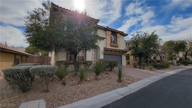 mediterranean / spanish-style home featuring a garage