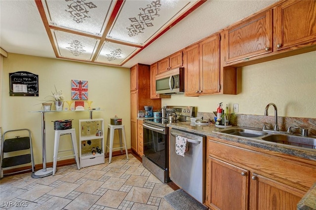 kitchen with appliances with stainless steel finishes and sink