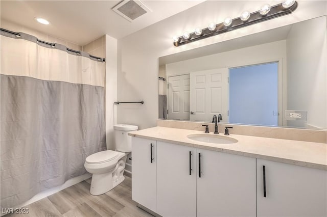 200 W Sahara Ave Unit 2108, Las Vegas, NV 89102 - bathroom with toilet, wood finished floors, vanity, and curtained shower
