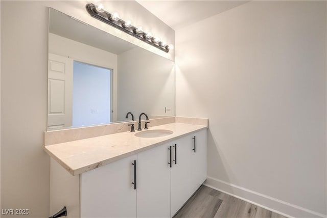 200 W Sahara Ave Unit 2108, Las Vegas, NV 89102 - bathroom with wood finished floors, baseboards, and vanity