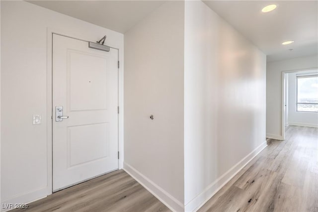 200 W Sahara Ave Unit 2108, Las Vegas, NV 89102 - corridor with light wood finished floors, baseboards, and recessed lighting