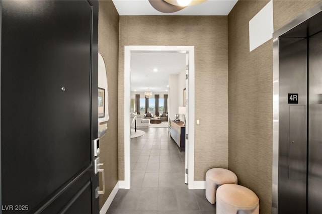 interior space featuring elevator and tile patterned flooring