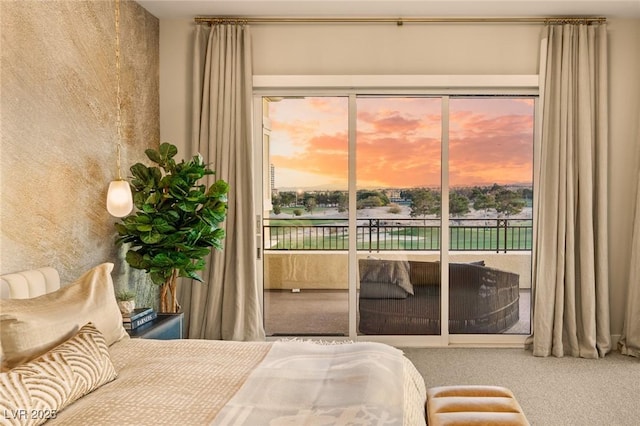 carpeted bedroom with access to outside