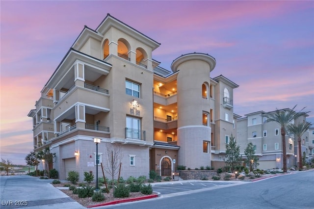 view of outdoor building at dusk