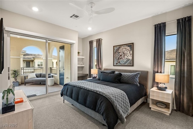 bedroom featuring light carpet, access to exterior, and ceiling fan